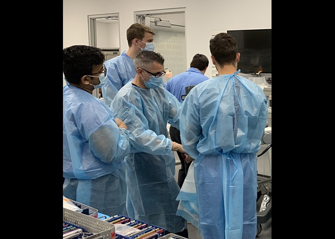 Residents engaged in wet lab training.