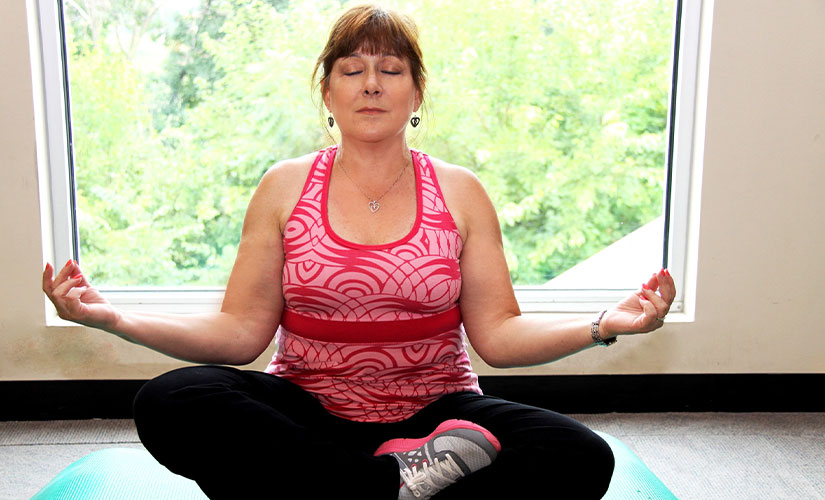 Woman going through yoga routine